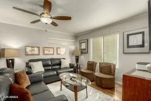 a living room with furniture and a large window