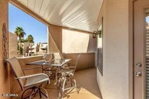 a view of an outdoor dining space with furniture