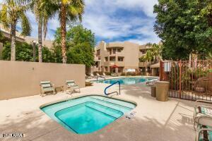 4850 East Desert Cove Avenue, Unit 227 Scottsdale, AZ 85254 - Photo 29 of 32 a view of a swimming pool with a patio