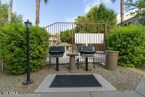 4850 East Desert Cove Avenue, Unit 227 Scottsdale, AZ 85254 - Photo 30 of 32 a view of a patio with a chairs in patio