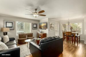 4850 East Desert Cove Avenue, Unit 227 Scottsdale, AZ 85254 - Photo 4 of 32 a living room with furniture and a large window