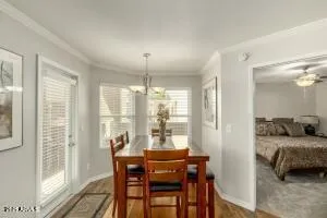 a bedroom with furniture and a large window