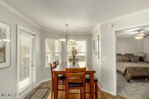 4850 East Desert Cove Avenue, Unit 227 Scottsdale, AZ 85254 - Photo 9 of 32 a bedroom with furniture and a large window