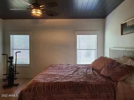 a bedroom with a bed and a table