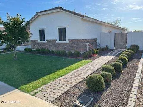 a view of backyard with patio