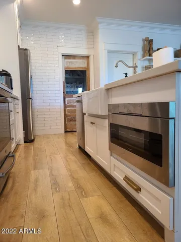 a kitchen with a stove and cabinets