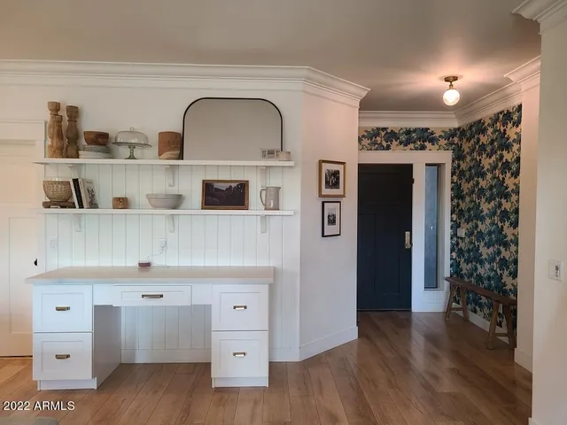 a view of a room with furniture and a flat screen tv