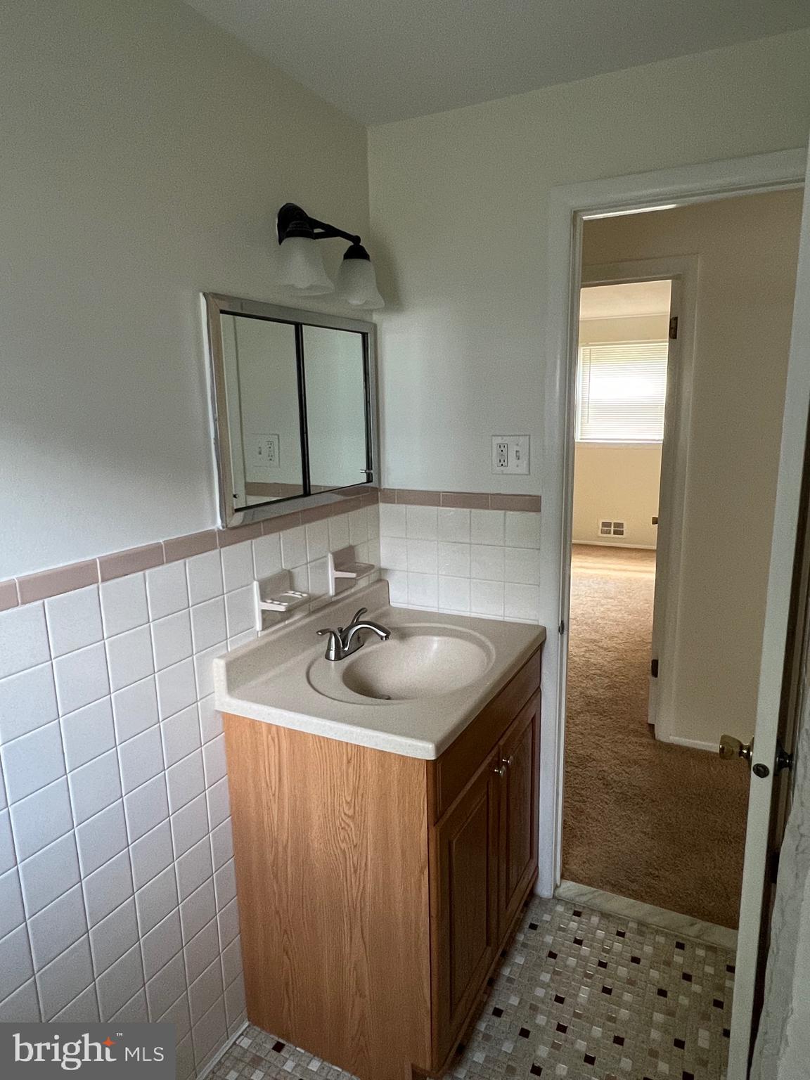 262 Evergreen Avenue, Unit 1 Hamilton, NJ 08619 - Photo 14 of 20 a bathroom with a sink a toilet and shower