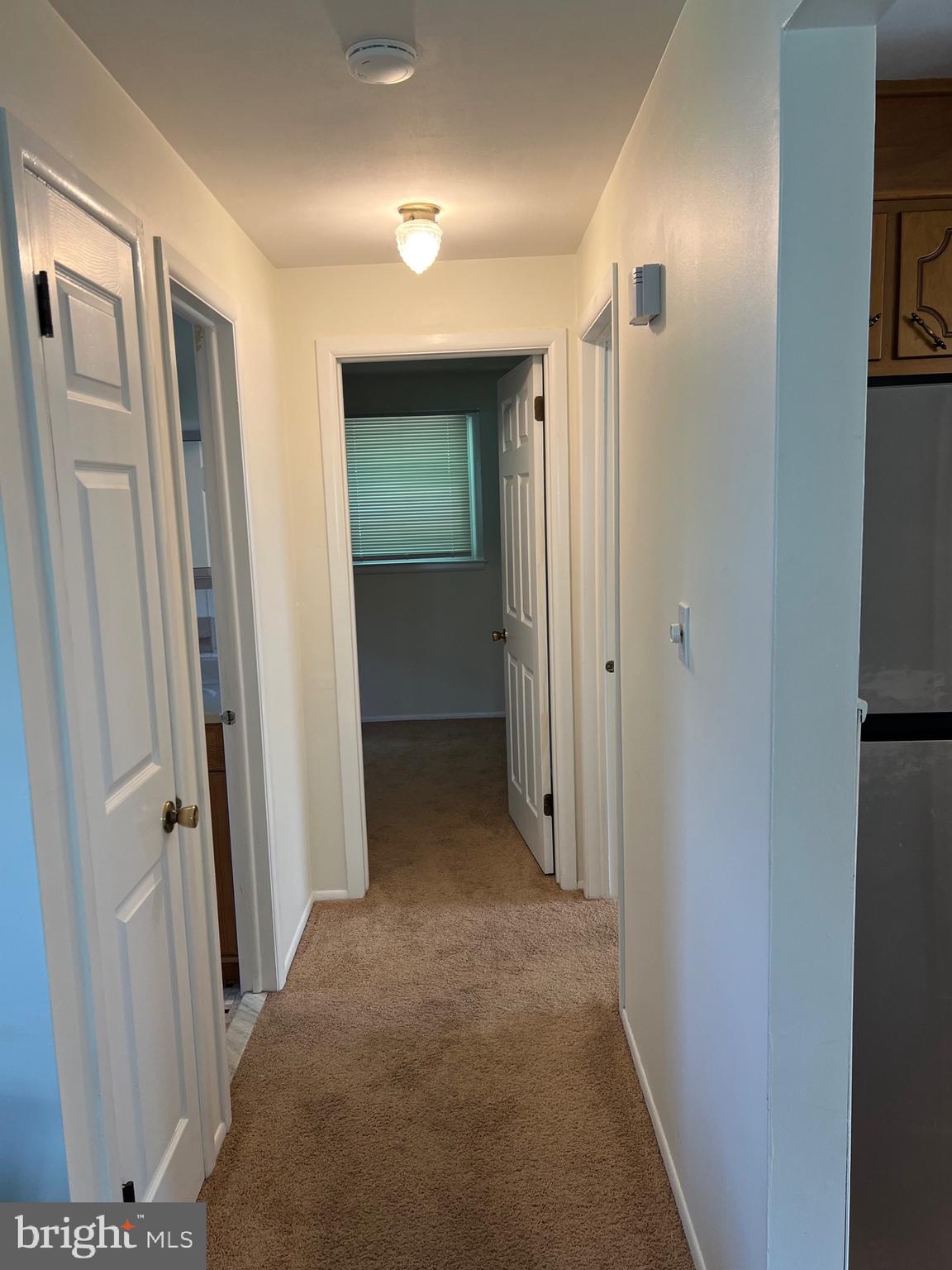 262 Evergreen Avenue, Unit 1 Hamilton, NJ 08619 - Photo 4 of 20 a view of a hallway with closet and wooden floor