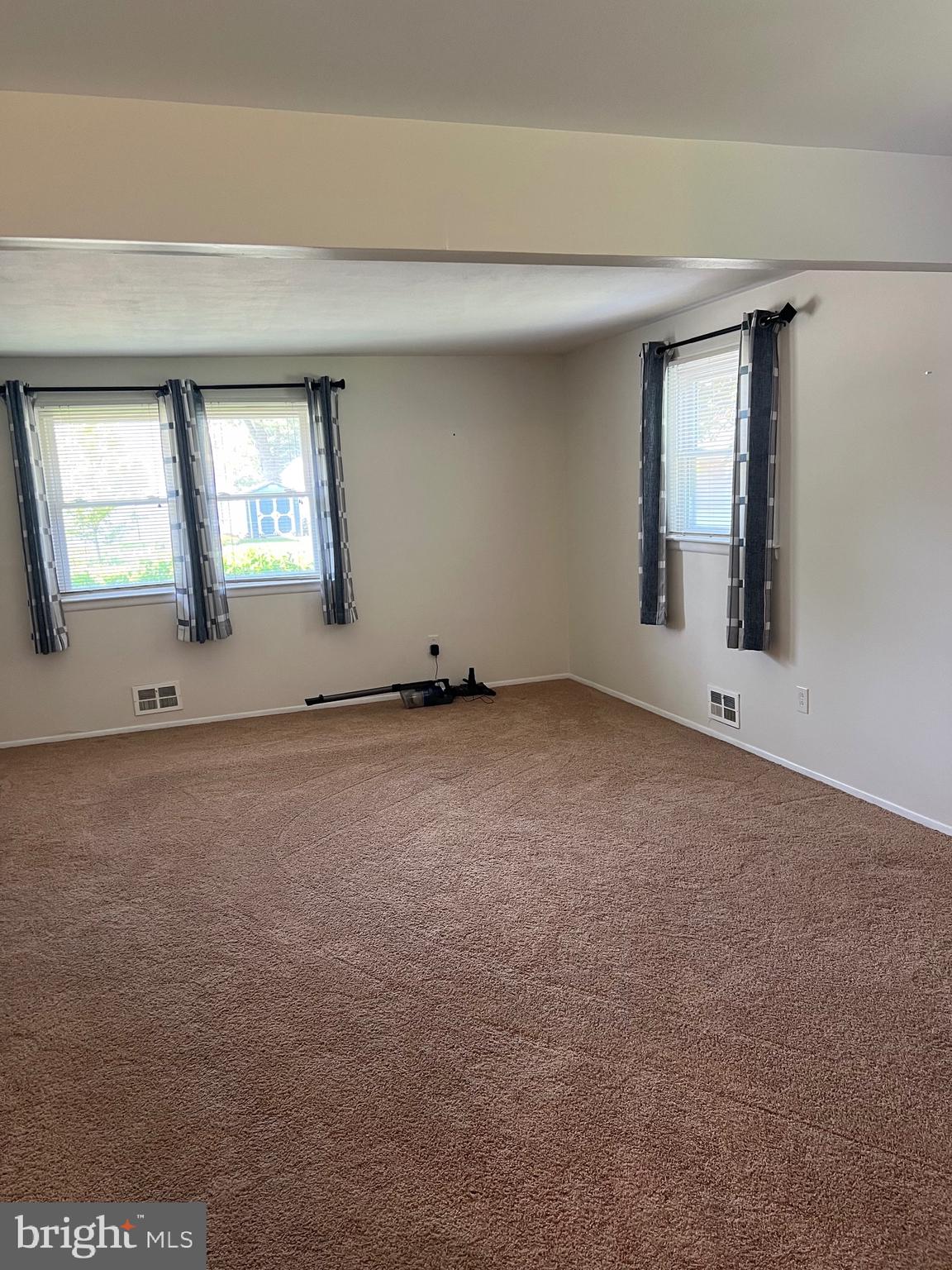 262 Evergreen Avenue, Unit 1 Hamilton, NJ 08619 - Photo 5 of 20 an empty room with a empty space and windows