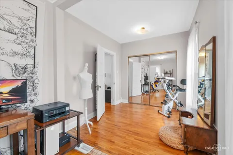 a view of a livingroom with furniture and a flat screen tv
