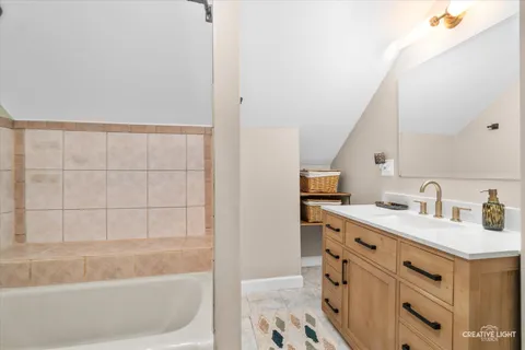a bathroom with a sink and a bathtub