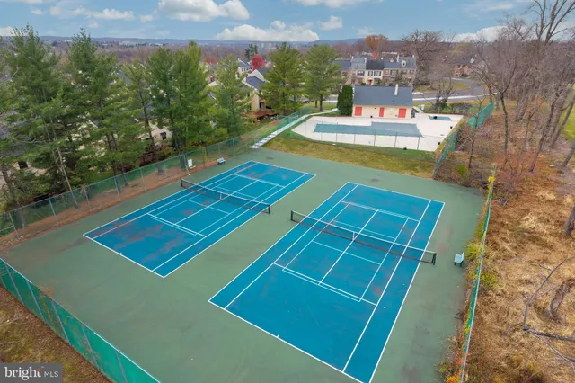 a view of a house with pool and yard