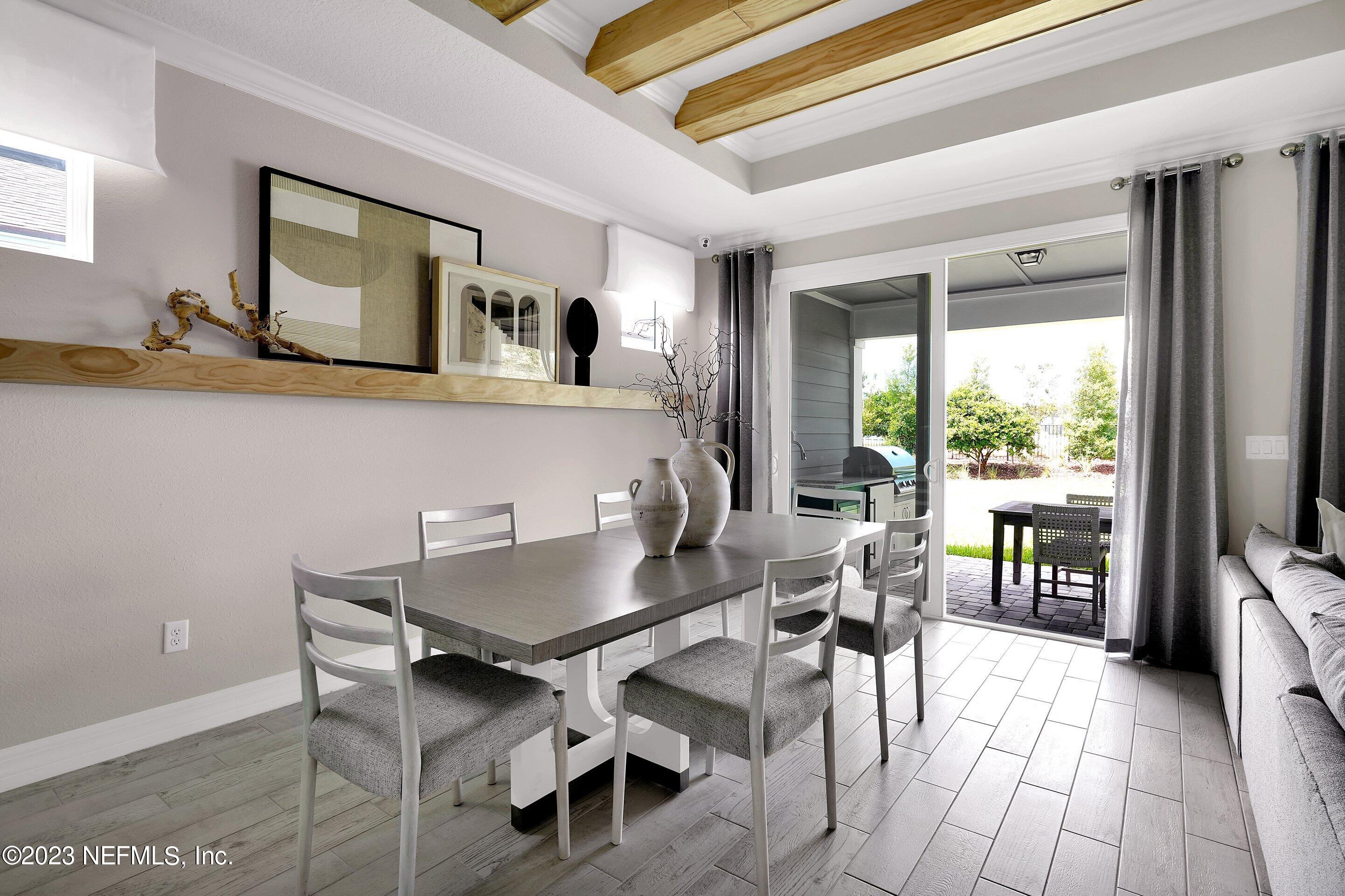 384 Del Webb Parkway Yulee, FL 32097 - Photo 12 of 35 a workspace with furniture and a large window