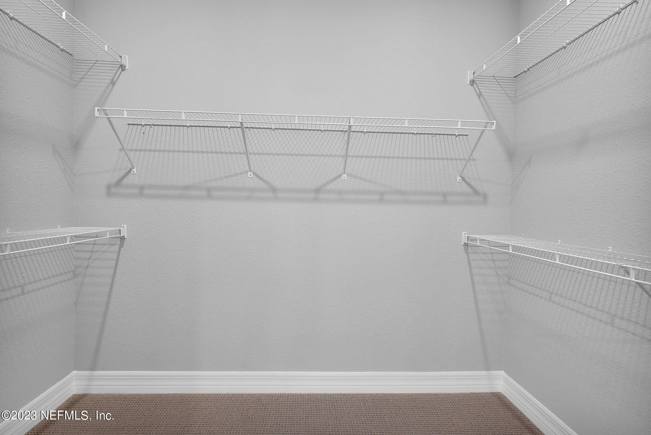 384 Del Webb Parkway Yulee, FL 32097 - Photo 22 of 35 a view of a room with shelf