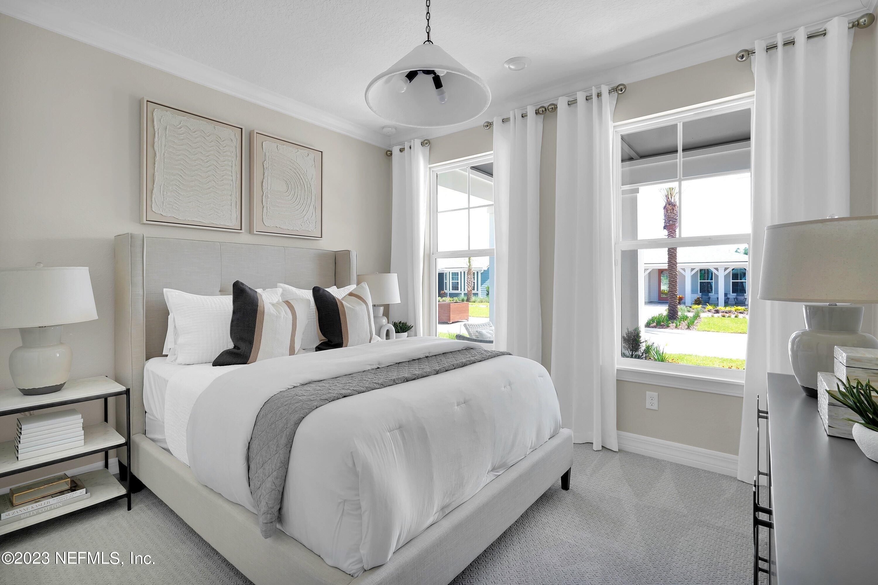 384 Del Webb Parkway Yulee, FL 32097 - Photo 23 of 35 a bedroom with bed and window