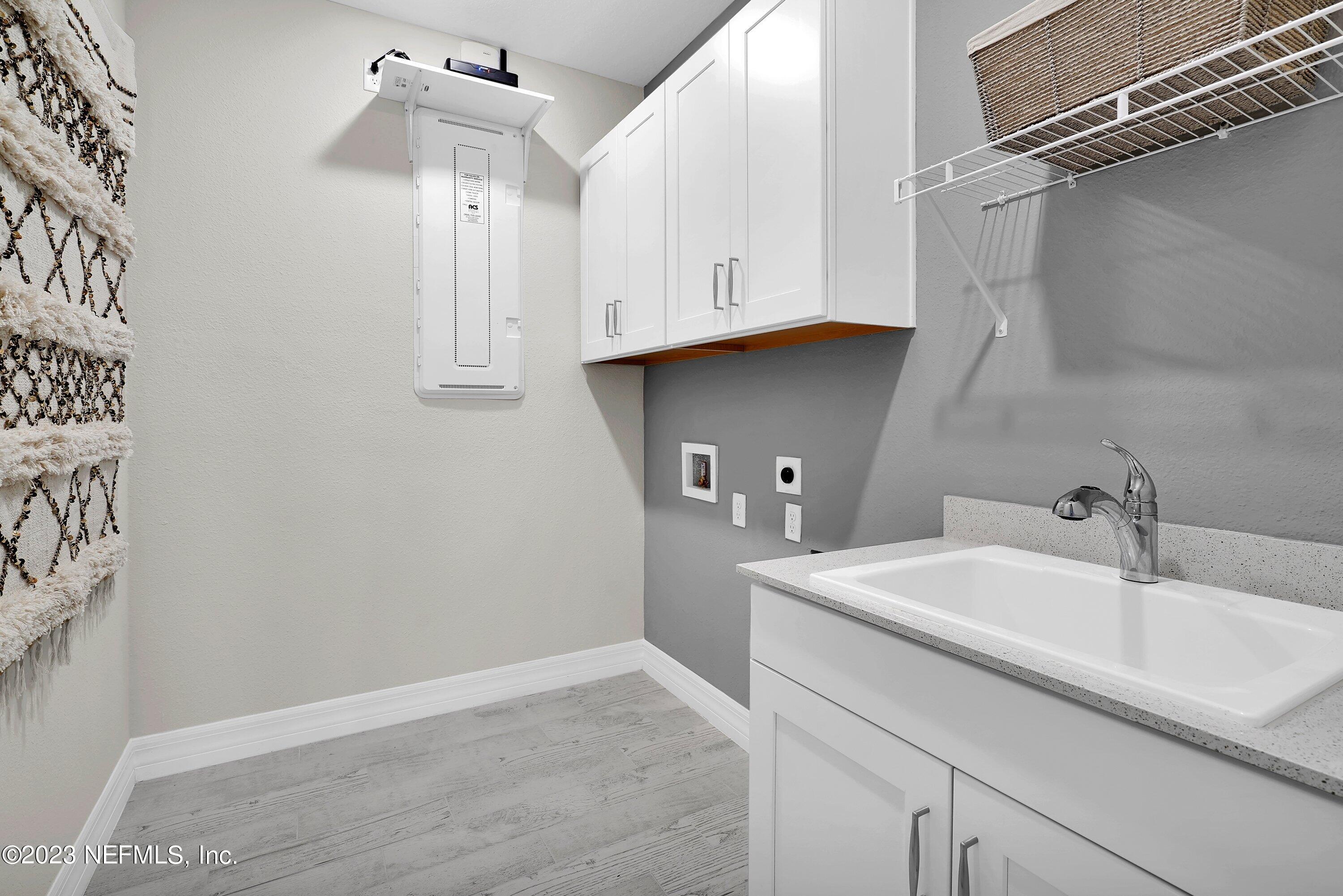 384 Del Webb Parkway Yulee, FL 32097 - Photo 25 of 35 a bathroom with a sink and a mirror