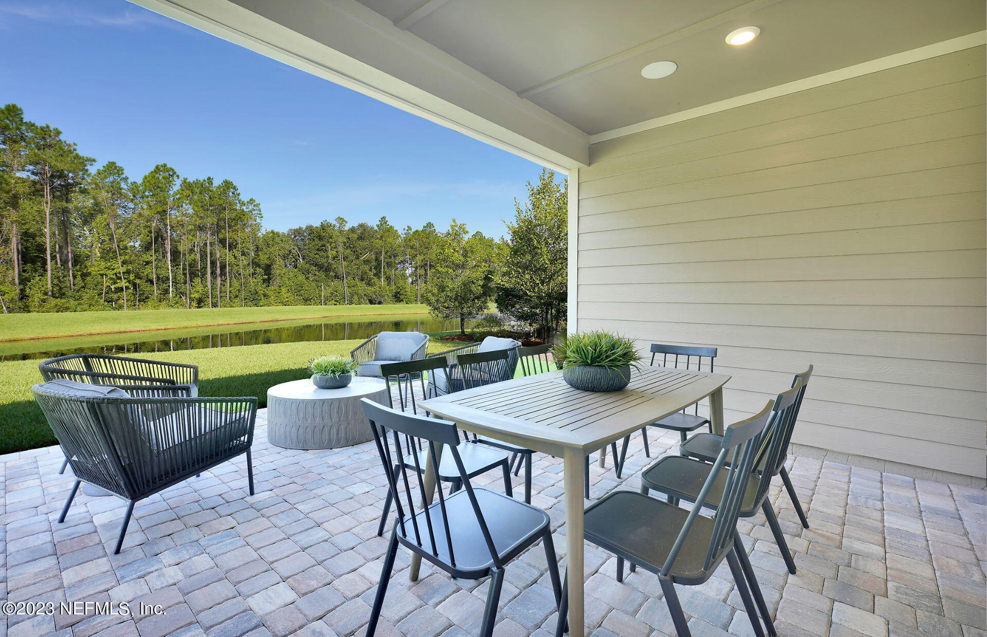 384 Del Webb Parkway Yulee, FL 32097 - Photo 26 of 35 a view of a chairs and table in patio