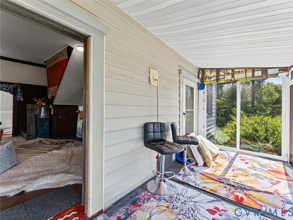 265 Signboard Road Bumpass, VA 23024 - Photo 34 of 39 Enclosed porch featuring large windows, horizontal