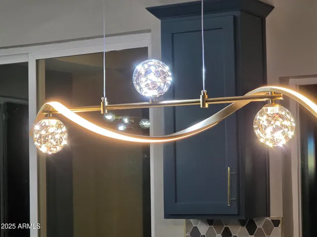 a view of a chandelier in hallway