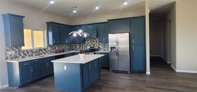 a kitchen with a stove and a wooden cabinets