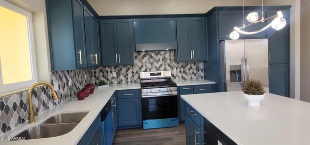 a stove top oven sitting inside of a kitchen