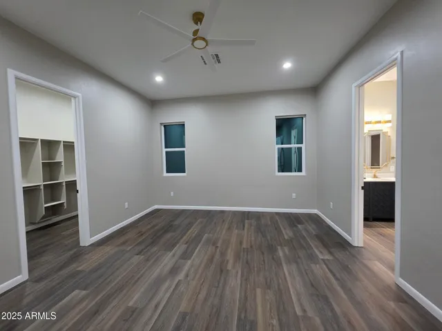 a bathroom with a double vanity sink mirror and shower