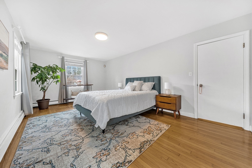 15 Spring Valley Road Belmont, MA 02478 - Photo 11 of 29 a bedroom with a bed and a table