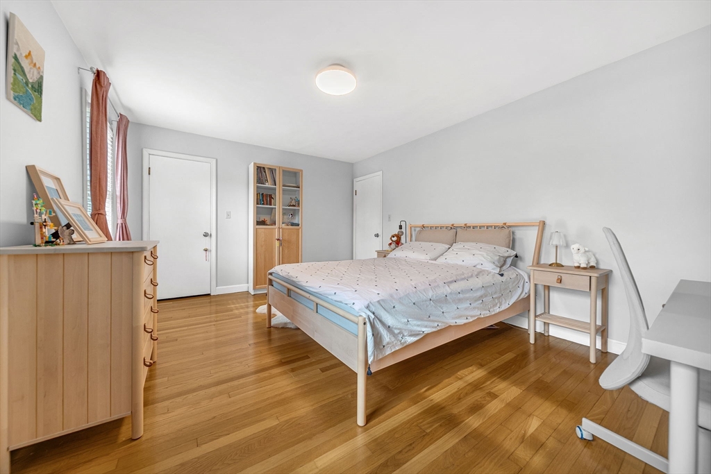 15 Spring Valley Road Belmont, MA 02478 - Photo 12 of 29 a bedroom with a bed and a table in it