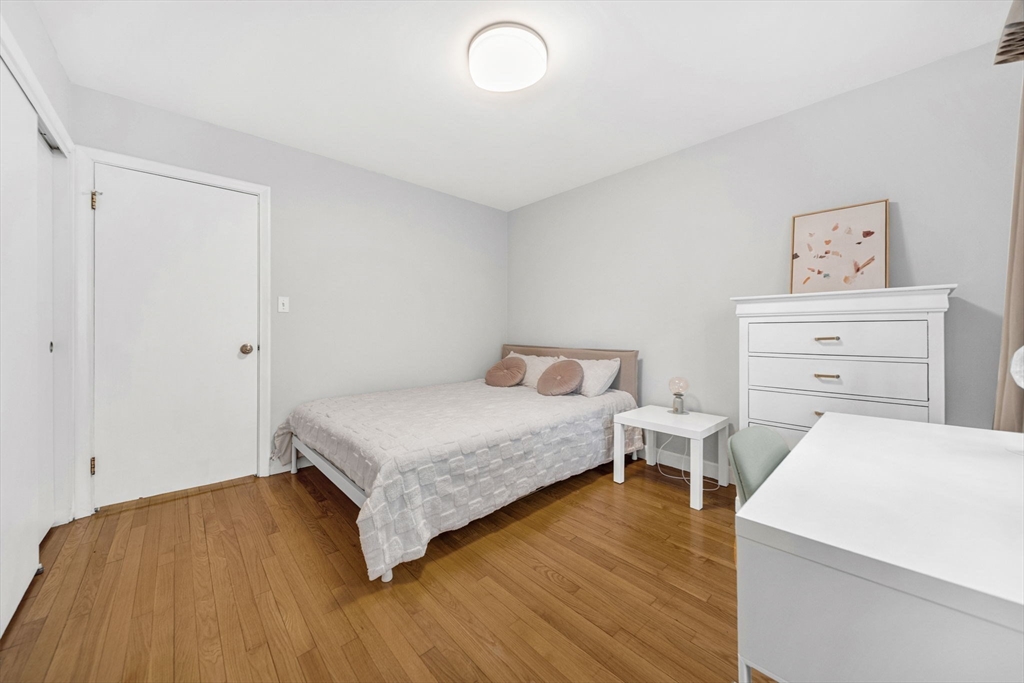 15 Spring Valley Road Belmont, MA 02478 - Photo 17 of 29 a bedroom with a bed and a table in it