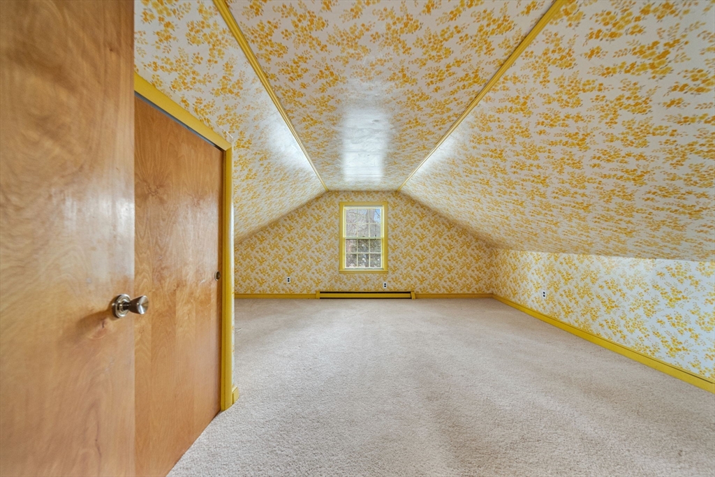 15 Spring Valley Road Belmont, MA 02478 - Photo 22 of 29 a view of a hallway with a wooden door
