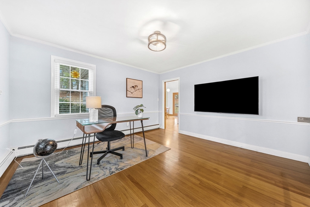 15 Spring Valley Road Belmont, MA 02478 - Photo 4 of 29 a living room with furniture and a flat screen tv