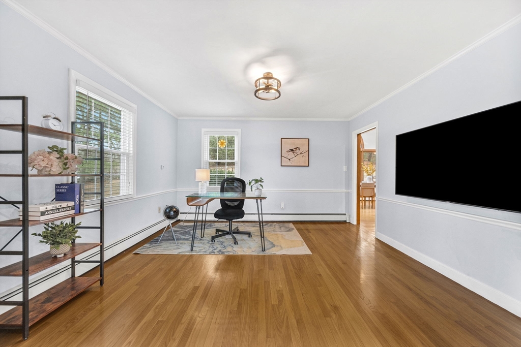 15 Spring Valley Road Belmont, MA 02478 - Photo 5 of 29 a living room with furniture and a flat screen tv