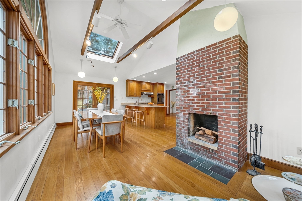15 Spring Valley Road Belmont, MA 02478 - Photo 10 of 29 a living room with furniture a fireplace and a flat screen tv