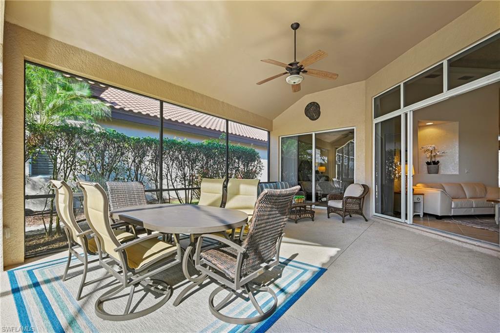 12592 Grandezza Circle Estero, FL 33928 - Photo 14 of 40 a dining room with furniture water view and a floor to ceiling window