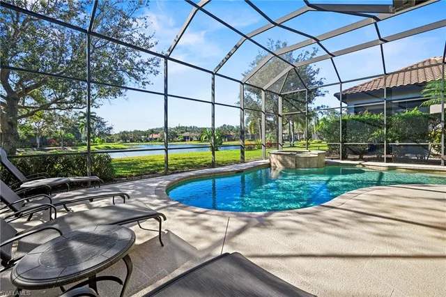a view of a backyard with swimming pool