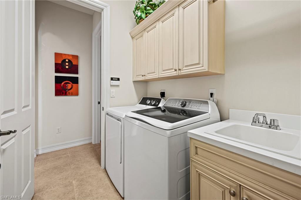 12592 Grandezza Circle Estero, FL 33928 - Photo 25 of 40 a utility room with dryer and washer
