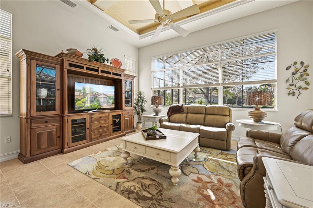 12592 Grandezza Circle Estero, FL 33928 - Photo 3 of 40 a living room with furniture and a flat screen tv