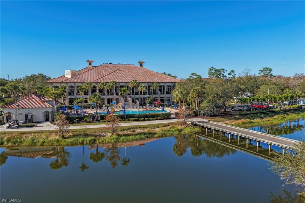 12592 Grandezza Circle Estero, FL 33928 - Photo 39 of 40 a view of a swimming pool with a lounge chair