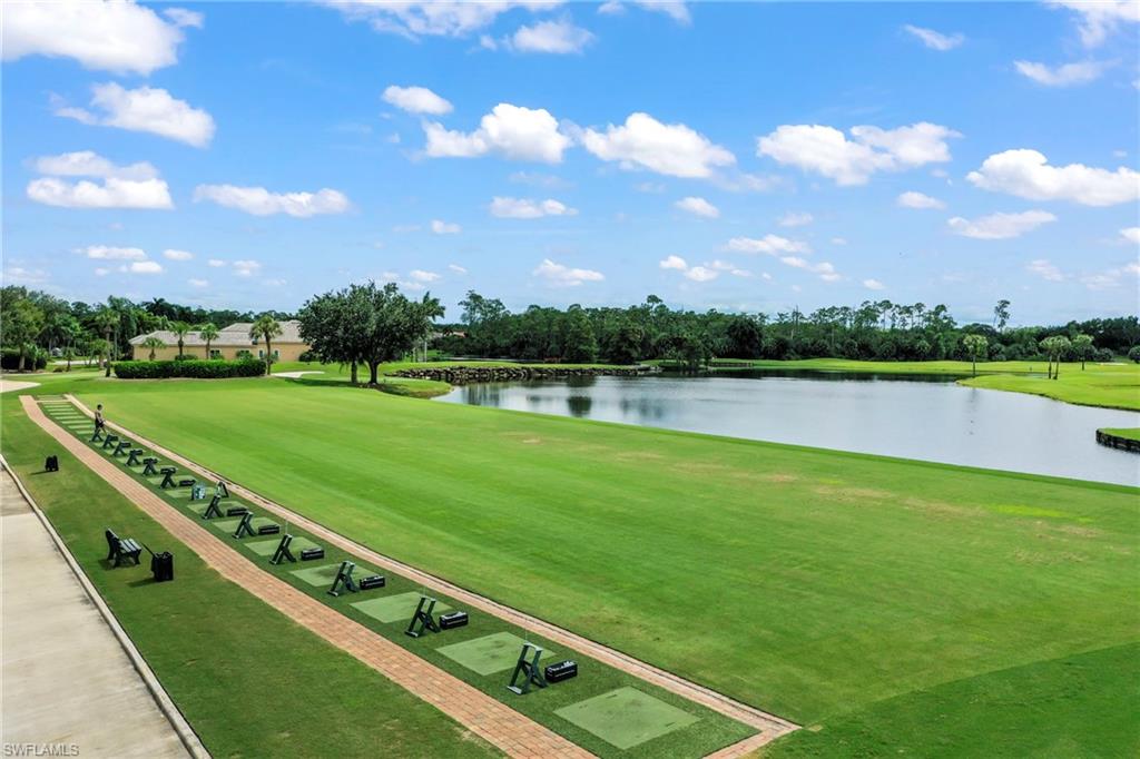 12592 Grandezza Circle Estero, FL 33928 - Photo 40 of 40 a view of a lake with houses in the back