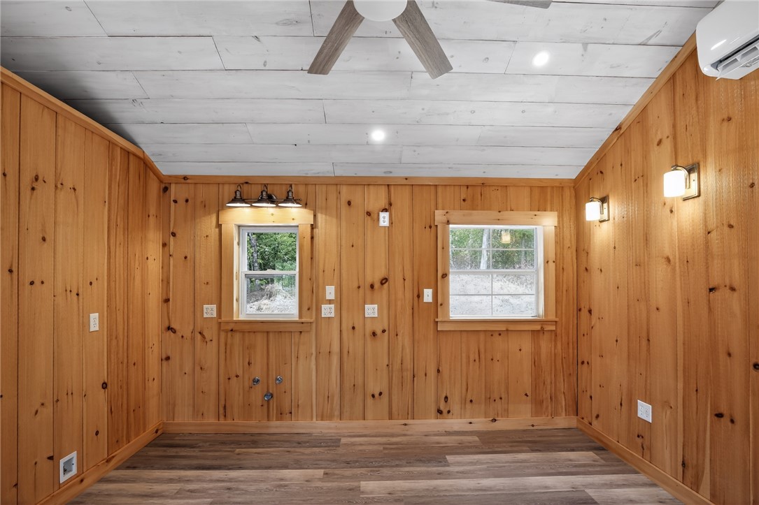 400 Mill Creek Road Sunset, SC 29685 - Photo 2 of 8 Natural pine plank walls and a wood-paneled ceiling create a warm and inviting atmosphere.