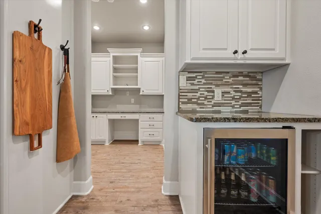 a kitchen with stainless steel appliances granite countertop a stove and a refrigerator