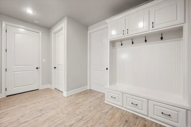 a view of an empty room with cabinet