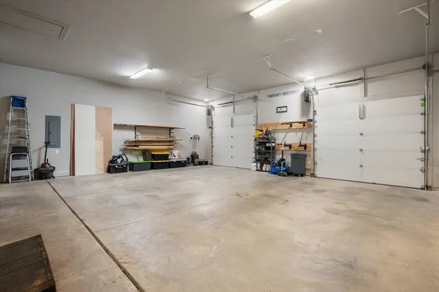 an empty room with a window and a ceiling fan