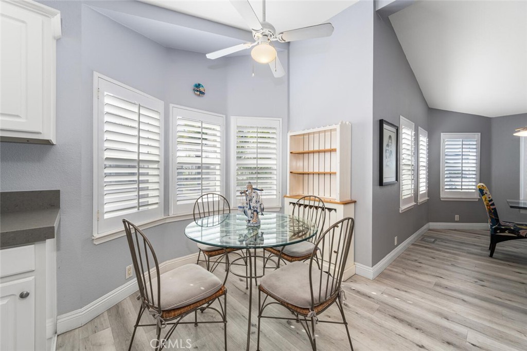 16222 Monterey Lane, Unit 371 Huntington Beach, CA 92649 - Photo 16 of 70 a dining room with furniture and window