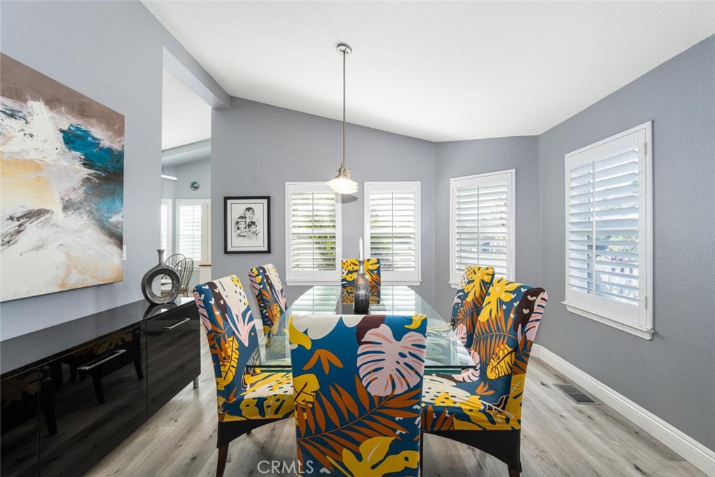 16222 Monterey Lane, Unit 371 Huntington Beach, CA 92649 - Photo 18 of 70 a dining room with furniture and window