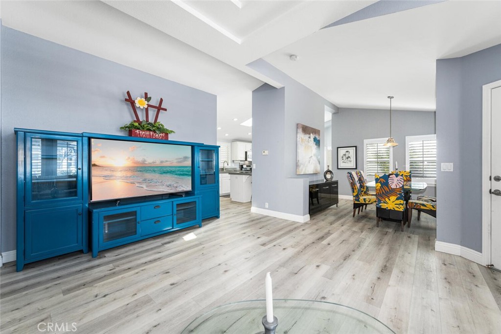 16222 Monterey Lane, Unit 371 Huntington Beach, CA 92649 - Photo 21 of 70 a living room with furniture and a flat screen tv