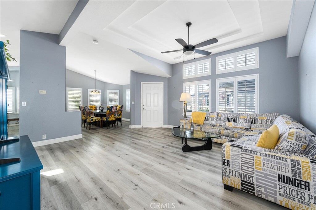 16222 Monterey Lane, Unit 371 Huntington Beach, CA 92649 - Photo 22 of 70 a living room with furniture and a chandelier