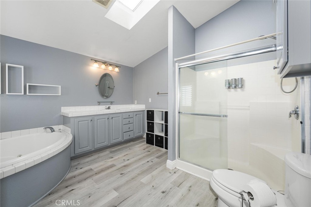 16222 Monterey Lane, Unit 371 Huntington Beach, CA 92649 - Photo 30 of 70 Master bathroom offers separate jetted tub and walk-in shower and an added skylight.