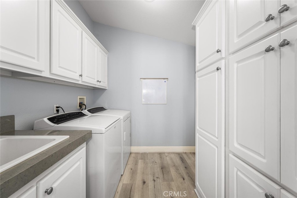 16222 Monterey Lane, Unit 371 Huntington Beach, CA 92649 - Photo 45 of 70 a view of a kitchen with sink and cabinets